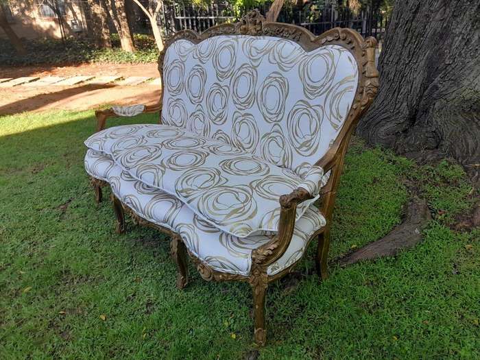 A 20TH Century French Hand Carved and Hand Gilded Settee