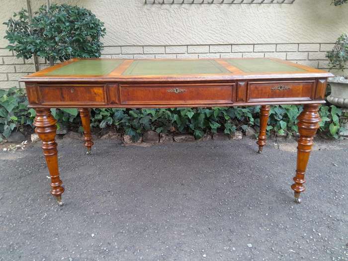 A 20th Century Kingswood Writing Table / Desk With Gilt Tooled Leather With Three Drawers On Bras...