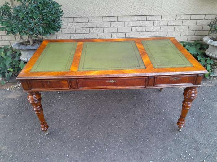 A 20th Century Kingswood Writing Table / Desk With Gilt Tooled Leather With Three Drawers On Bras...