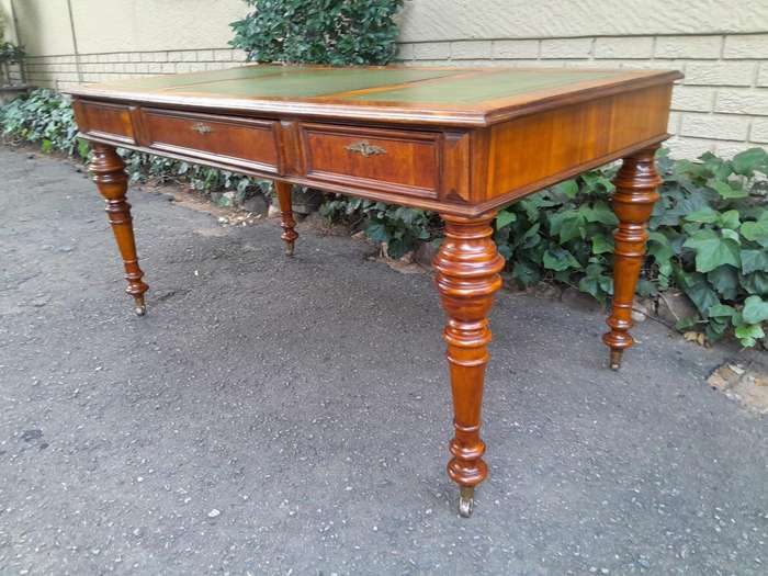 A 20th Century Kingswood Writing Table / Desk With Gilt Tooled Leather With Three Drawers On Bras...