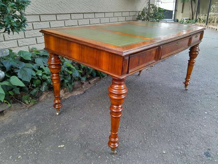 A 20th Century Kingswood Writing Table / Desk With Gilt Tooled Leather With Three Drawers On Bras...