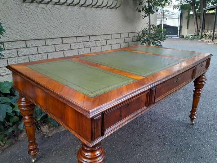 A 20th Century Kingswood Writing Table / Desk With Gilt Tooled Leather With Three Drawers On Bras...
