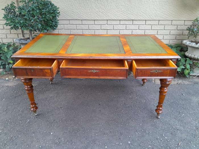 A 20th Century Kingswood Writing Table / Desk With Gilt Tooled Leather With Three Drawers On Bras...