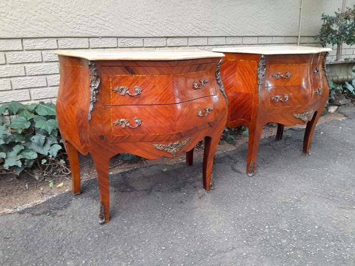 A 20th Century Pair of French Style Mahogany Bombe Pedestals with Marble Tops & Ormolu Mounts