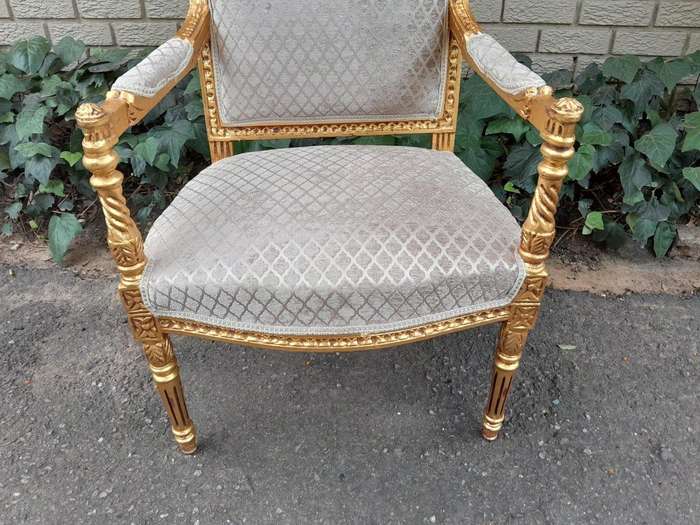 A Pair Of French Style Carved Wooden Gilded Armchairs