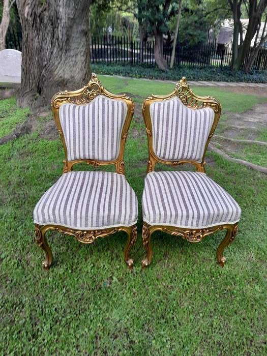 A Pair of French Rococo Style Carved Wooden Gilded Armchairs
