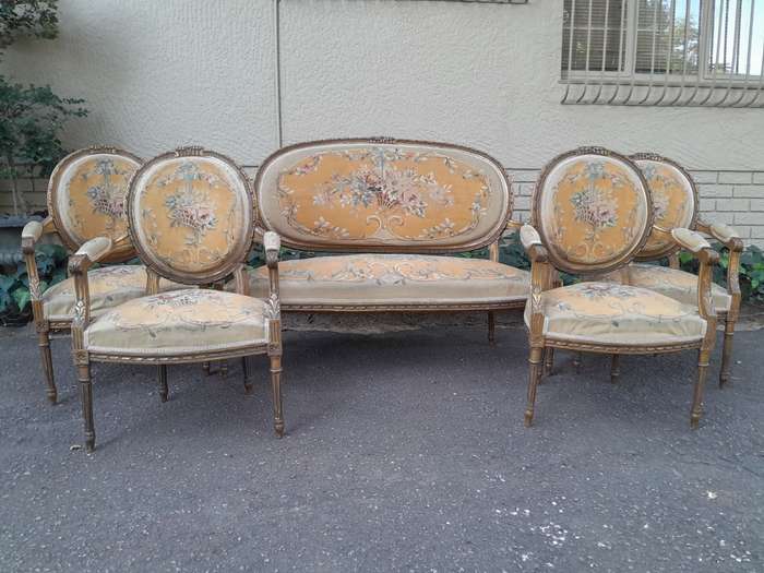 A 19th Century Antique French Giltwood Set Comprising a Settee and Four Medallion Armchairs uphol...