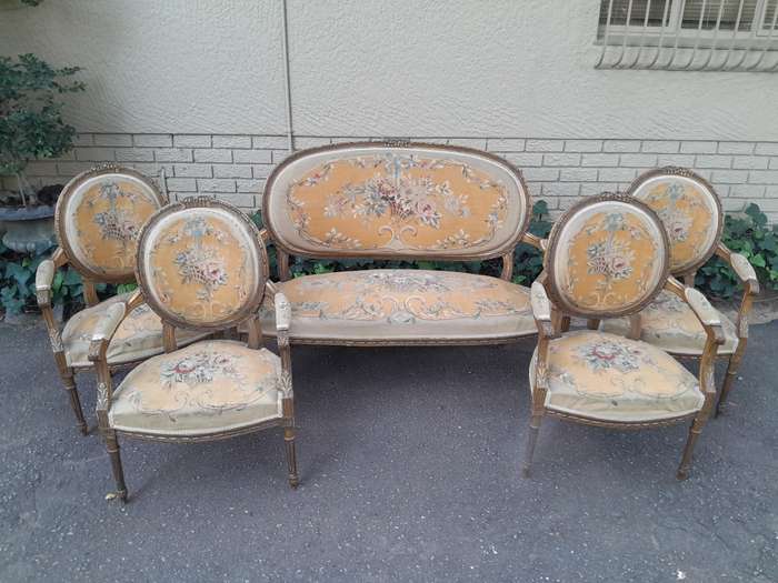 A 19th Century Antique French Giltwood Set Comprising a Settee and Four Medallion Armchairs uphol...