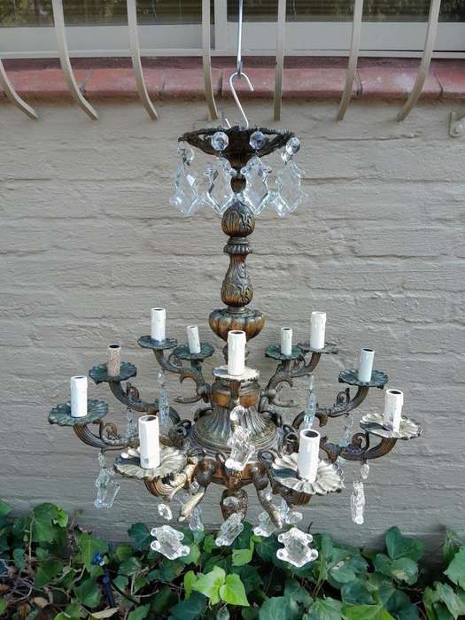 A 20th Century French Style Antique Brass and Crystal Twelve Light Chandelier