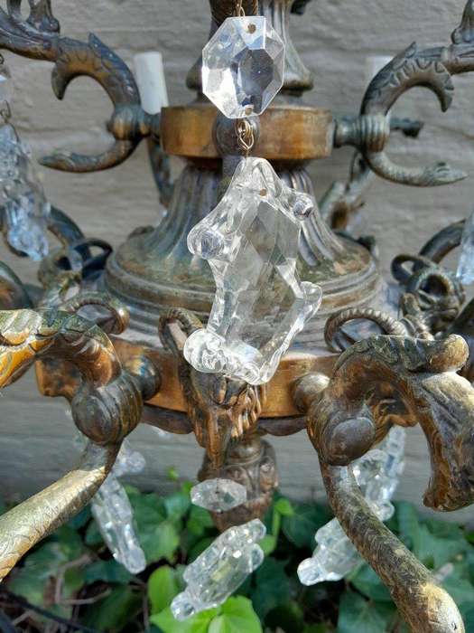 A 20th Century French Style Antique Brass and Crystal Twelve Light Chandelier