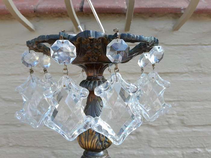 A 20th Century French Style Antique Brass and Crystal Twelve Light Chandelier