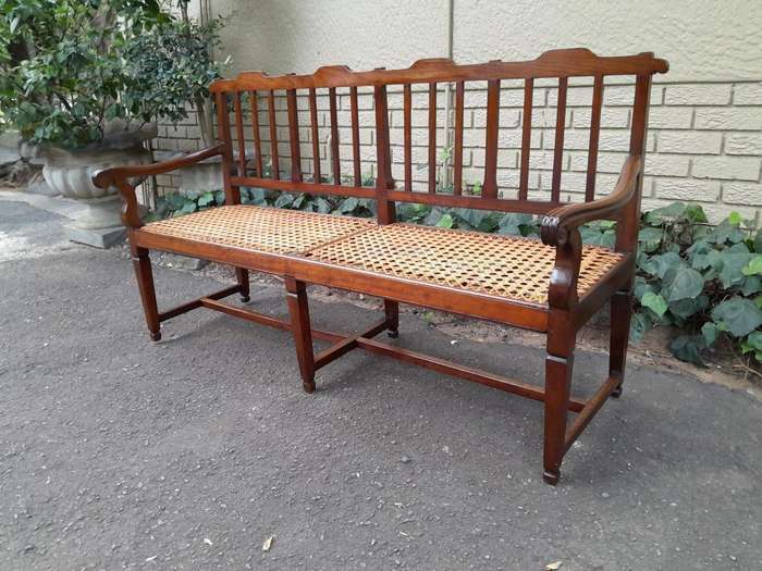 A 19th Century Cape Stinkwood Neo Classical Bench with Rattan Seat