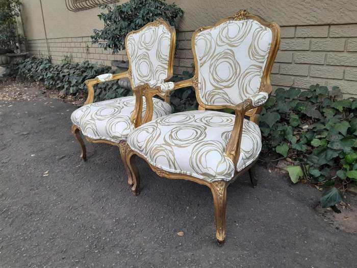 A 19th Century Pair of French Carved and Gilded Wooden Armchairs Upholstered in a Custom Made Fab...