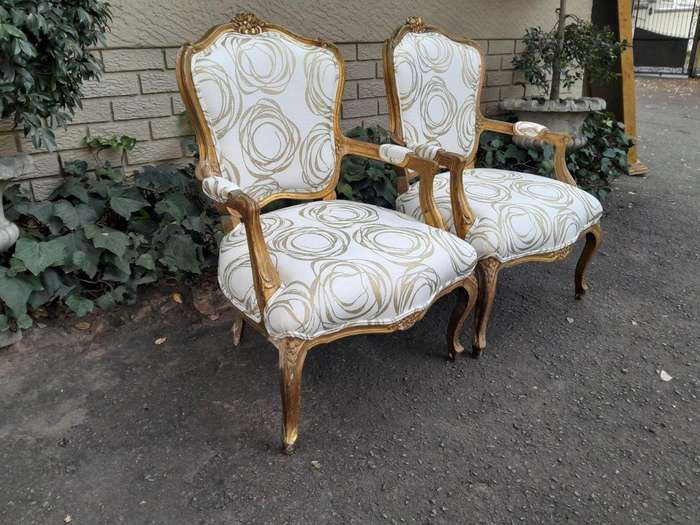 A 19th Century Pair of French Carved and Gilded Wooden Armchairs Upholstered in a Custom Made Fab...