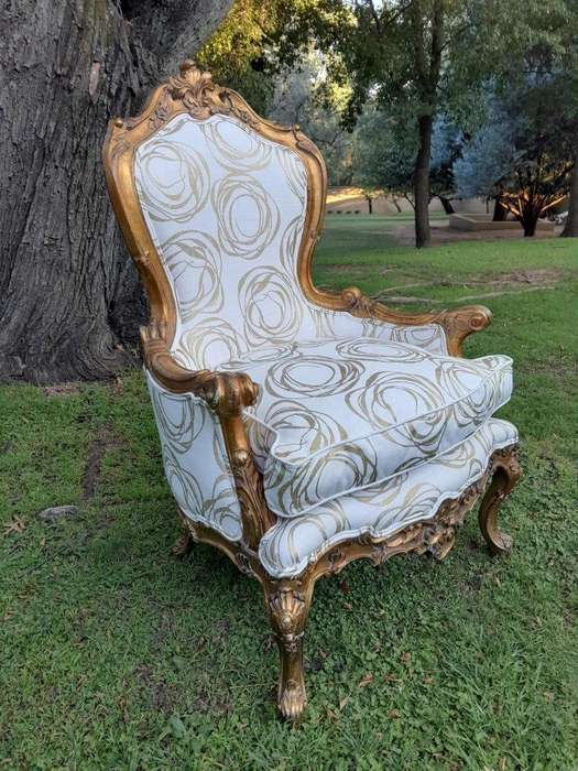 A 19th Century French Ornately Carved and Gilded Armchair of Large Proportion
