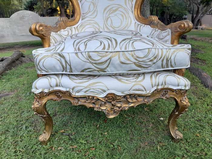 A 19th Century French Ornately Carved and Gilded Armchair of Large Proportion