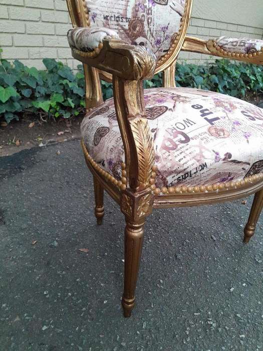 A 20th Century French Louis XVI Style Pair of Ornately Carved Gold Armchairs
