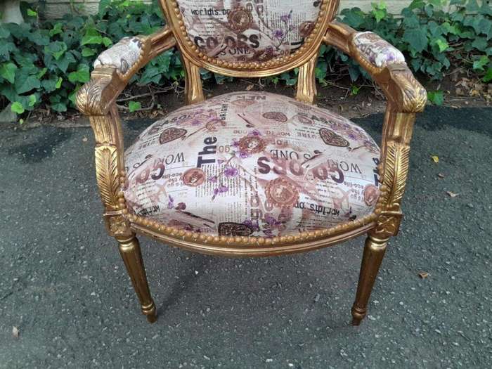 A 20th Century French Louis XVI Style Pair of Ornately Carved Gold Armchairs