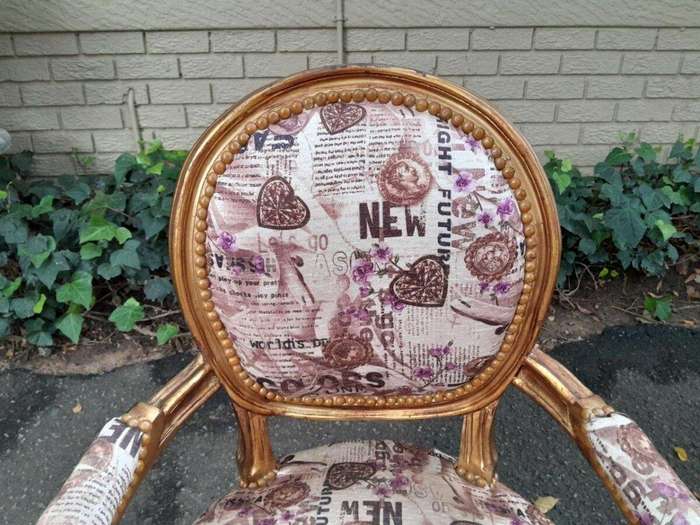 A 20th Century French Louis XVI Style Pair of Ornately Carved Gold Armchairs