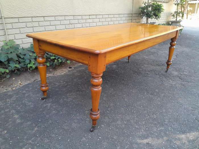 A Late 19thCentury  Early 20th Century Yellowwood Dining Table  with A 20th Century Set of Eigh...