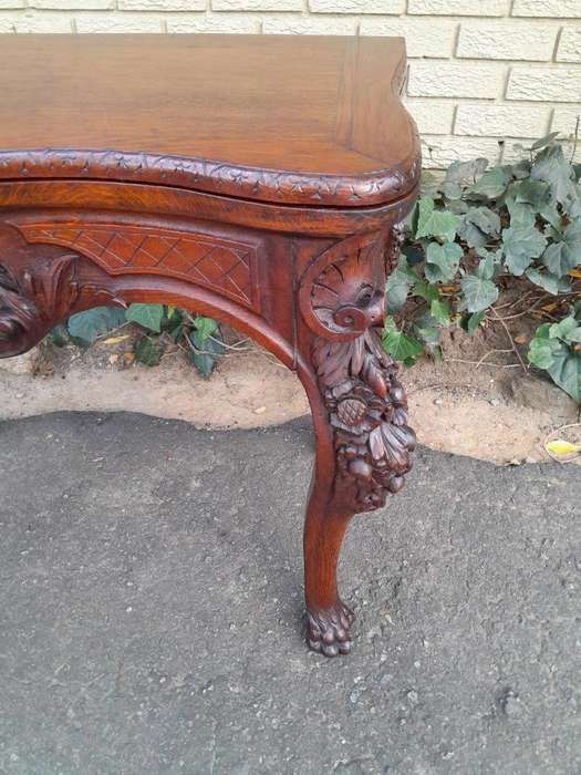An Antique Jacobean Ornately Carved Oak Card Table with Black Baize