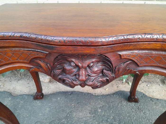 An Antique Jacobean Ornately Carved Oak Card Table with Black Baize