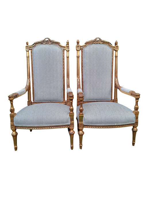 A Pair of French Rococo Style Ornately Carved Giltwood Arm Chairs Upholstered in a Contemporary T...