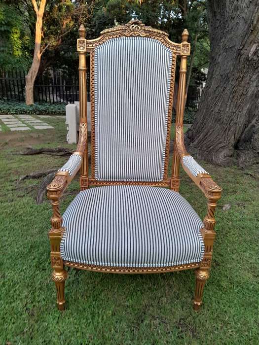 A Pair of French Rococo Style Ornately Carved Giltwood Arm Chairs Upholstered in a Contemporary T...