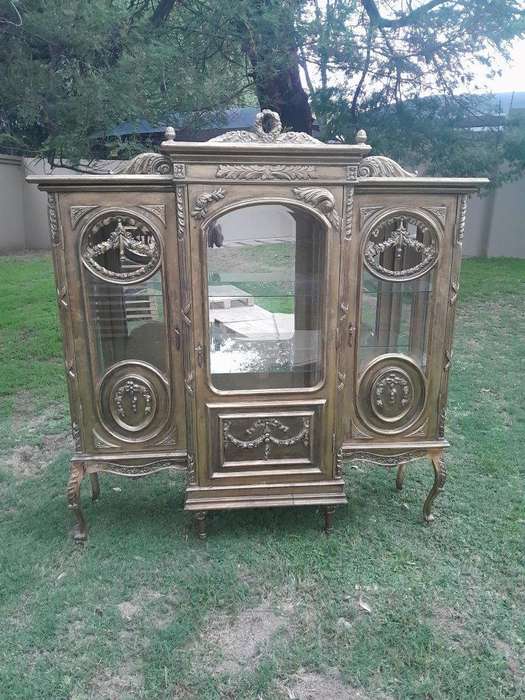A 20th Century French Style Three Division and Large Ornately Carved and Hand-Gilded Display Cabi...