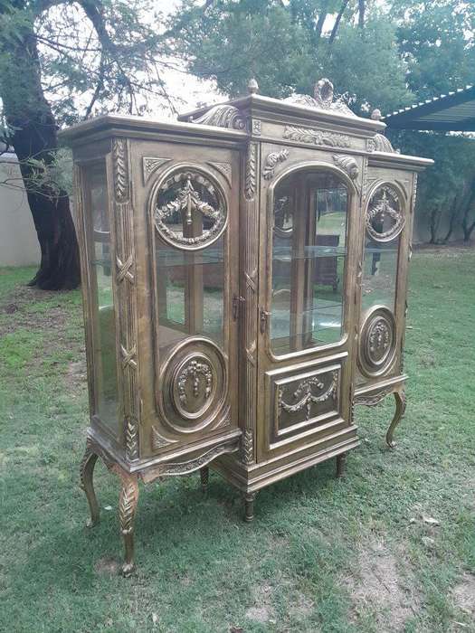 A 20th Century French Style Three Division and Large Ornately Carved and Hand-Gilded Display Cabi...