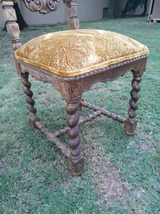 A Pair of 19th Century French Ornately Carved and Gilded Chairs