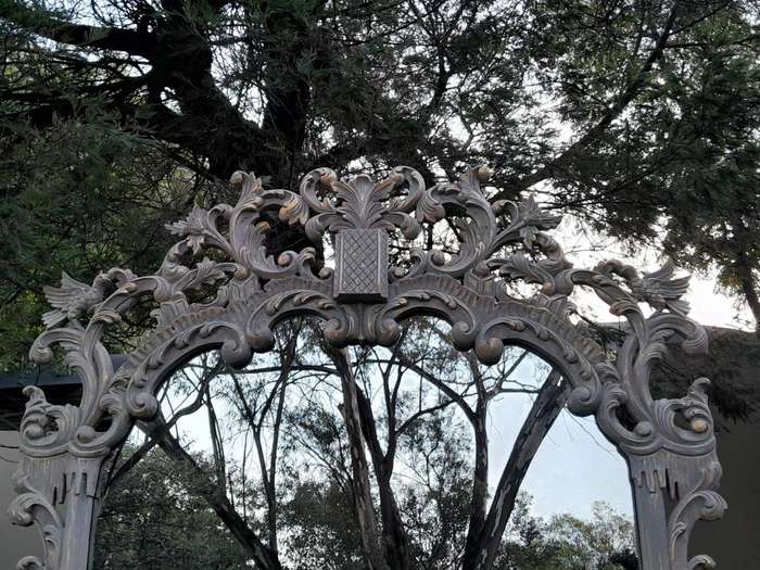A 20th Century French Style Carved Grey and Gilded Mirror
