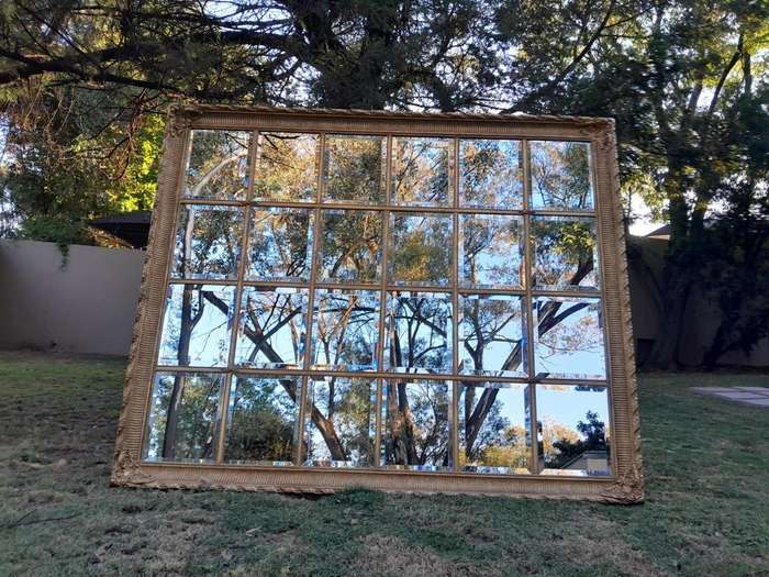 A French Style Heavily Carved and Gilded Framed Mirror with Bevelled Mirror Panes of Large Propor...