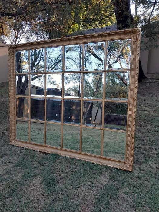 A French Style Heavily Carved and Gilded Framed Mirror with Bevelled Mirror Panes of Large Propor...