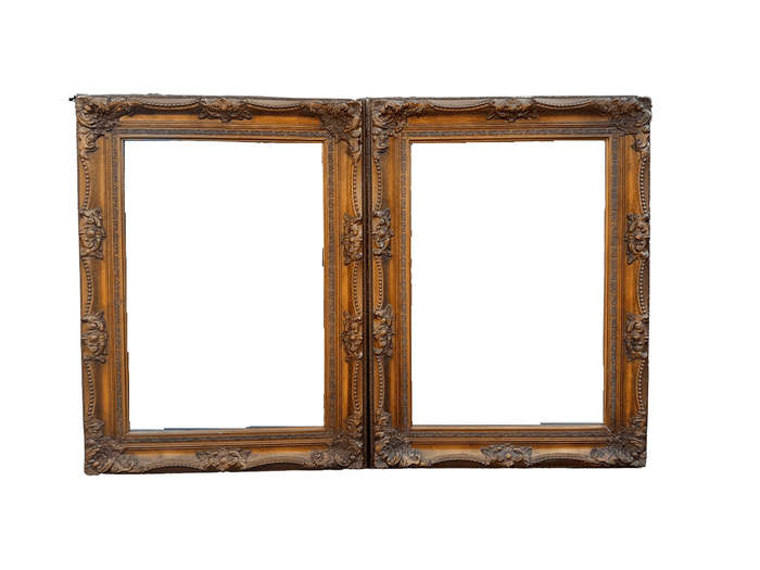 A 20th Century French Style Pair of Large and Ornately Carved Giltwood Mirrors