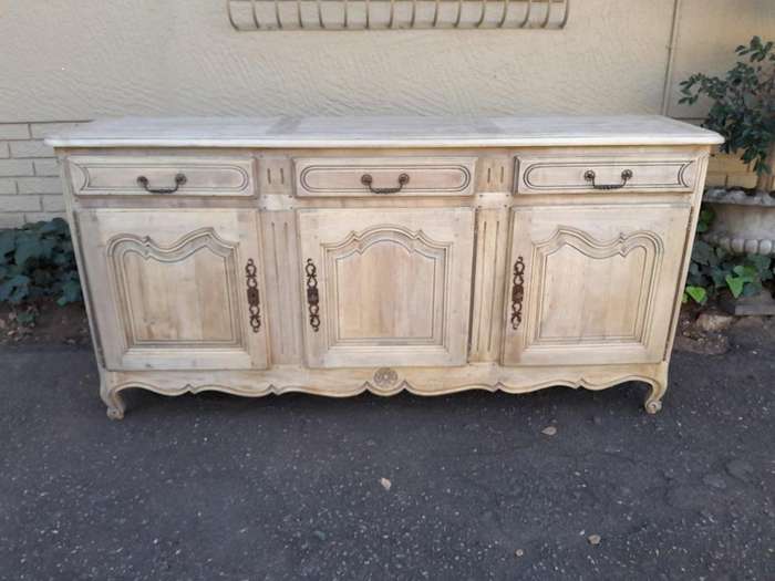 A 20TH Century French Walnut Sideboard with Original Iron hinges in a Contemporary Bleached Finish