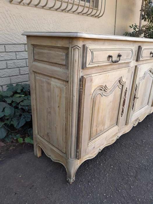 A 20TH Century French Walnut Sideboard with Original Iron hinges in a Contemporary Bleached Finish
