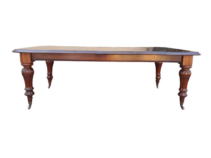 A Late 19th Century Victorian Mahogany Dining Table on Heavily Carved Legs and Original Castors
