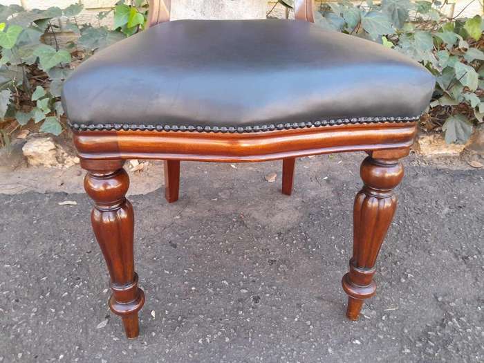 An Early 20th Century Victorian Set Of Ten Bustle Back Chairs Upholstered In Deep Button Leather