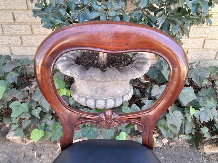 An Early 20th Century Victorian Set Of Ten Bustle Back Chairs Upholstered In Deep Button Leather