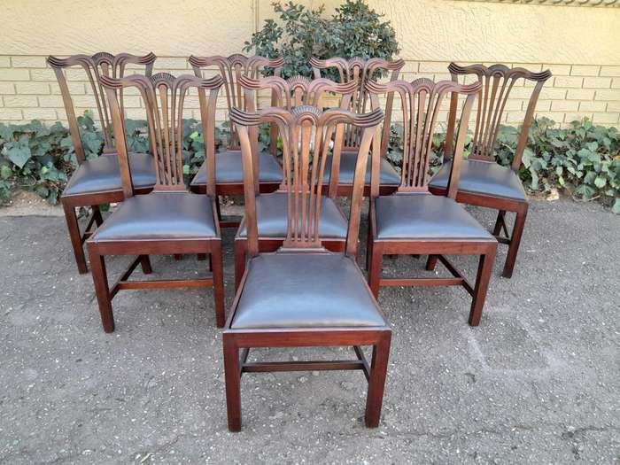 A 20th Century Set Of  Eight Carved Mahogany George Lll Style Dining Chairs Upholstered In Leather