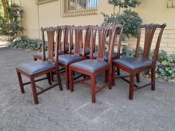 A 20th Century Set Of  Eight Carved Mahogany George Lll Style Dining Chairs Upholstered In Leather