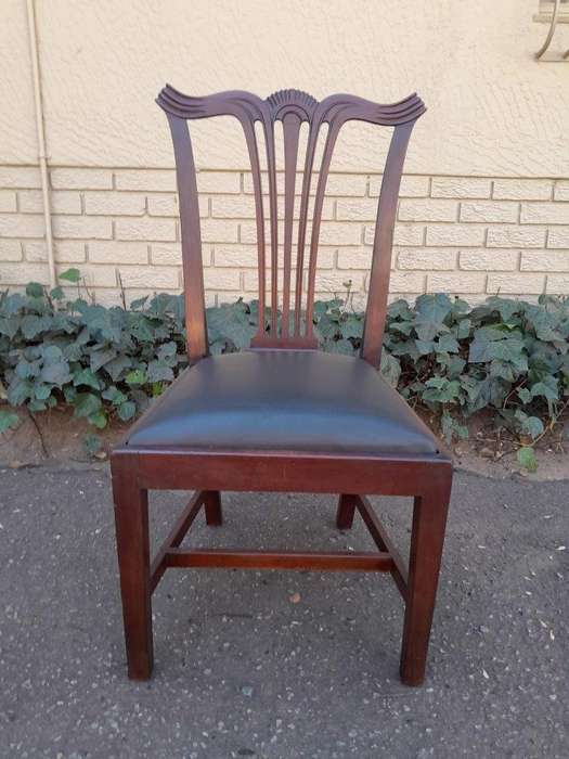 A 20th Century Set Of  Eight Carved Mahogany George Lll Style Dining Chairs Upholstered In Leather