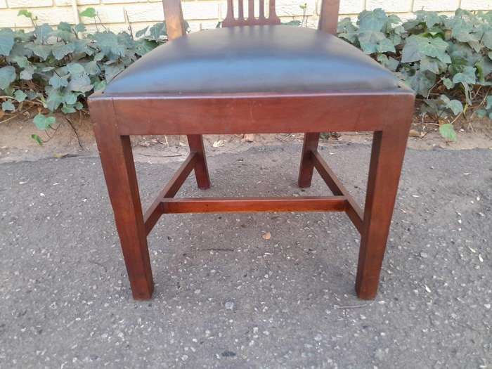 A 20th Century Set Of  Eight Carved Mahogany George Lll Style Dining Chairs Upholstered In Leather