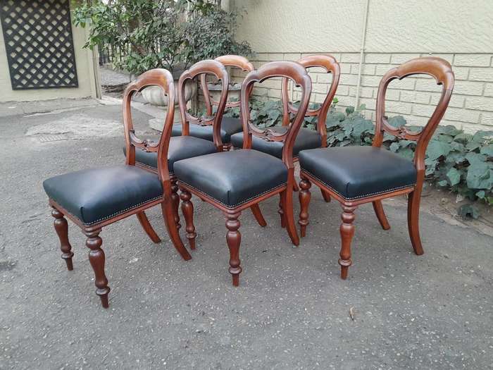 An Antique Set Of Six Victorian Carved Walnut Dining Chairs Upholstered In Leather