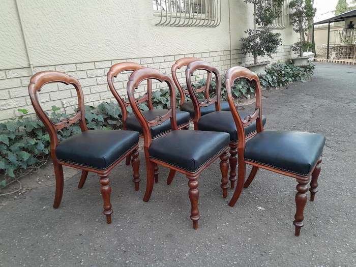 An Antique Set Of Six Victorian Carved Walnut Dining Chairs Upholstered In Leather