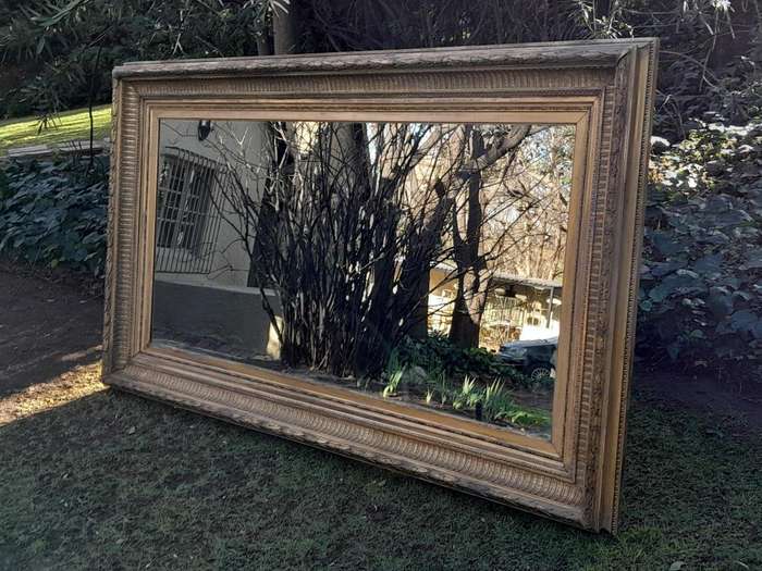 A 19th Century Carved Giltwood And Gesso Mirror Of Large Proportions