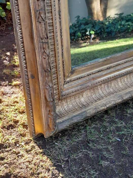 A 19th Century Carved Giltwood And Gesso Mirror Of Large Proportions