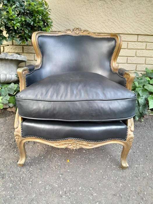 A 20th Century Pair of French Style Carved Giltwood Armchairs Upholstered in Leather