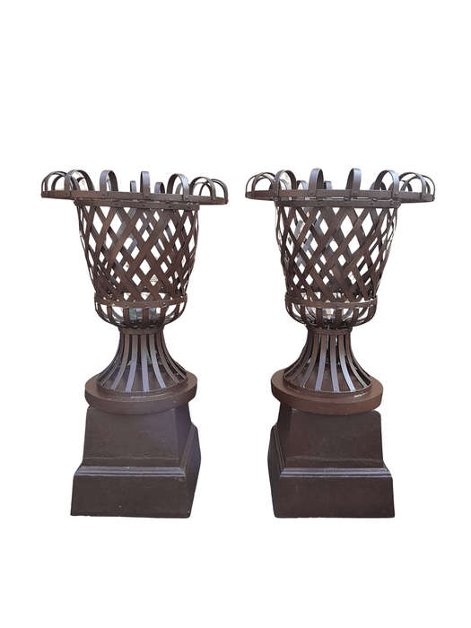 A 20th Century Pair of Decorative Wrought Iron Urns on Plinths